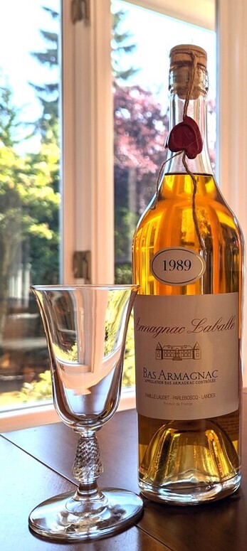 Glass with bottle of 1989 Armagnac